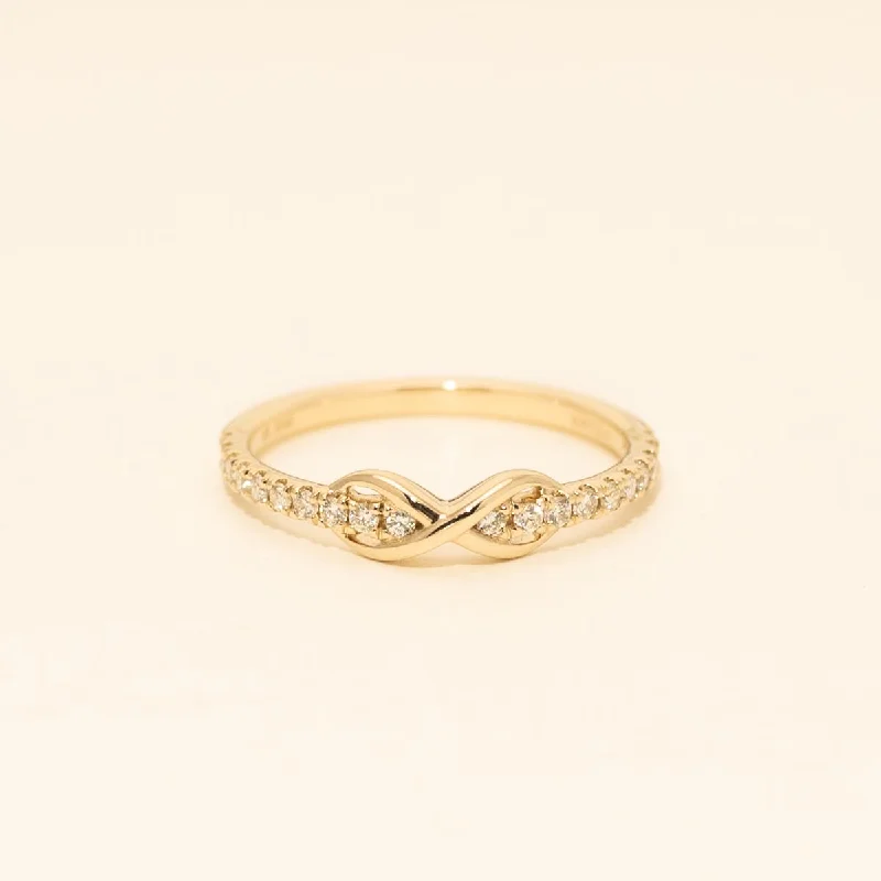 Women’s eternity rings with pave emerald bands -Northern Star Diamond Infinity Ring in 10kt Yellow Gold (1/5ct tw)